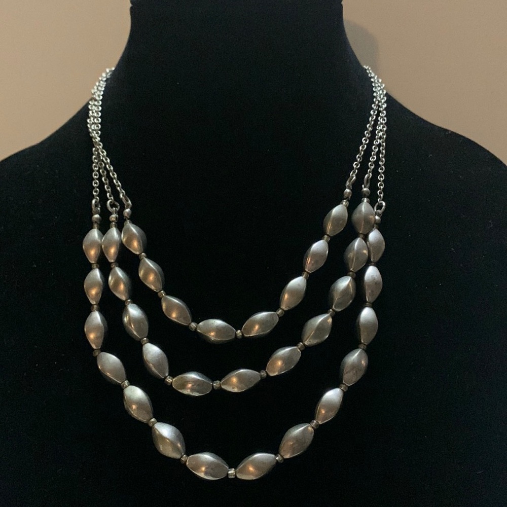 Chico’s silver necklace and earrings.